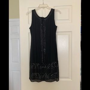 Adriana Papell black evening dress.